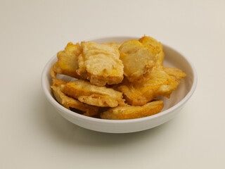 Fried tofu in white plate on white background