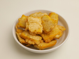 Fried tofu in white plate on white background