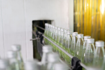 Factory of food or beverages, Conveyor for feed bottle, food or beverages on warehouse before send product to the customer. Quality control or assurance, Good standard