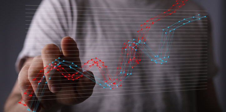 Hand interacting with a digital graph, visualizing data analysis and business growth. - Powered by Adobe