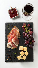 FlatLay Background of Chianti Wine, Pecorino Cheese and Prosciutto on Slate
