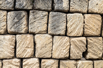 Square stone blocks forming a wall.