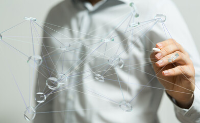 Image depicts a person interacting with a complex network, symbolizing global business connections...