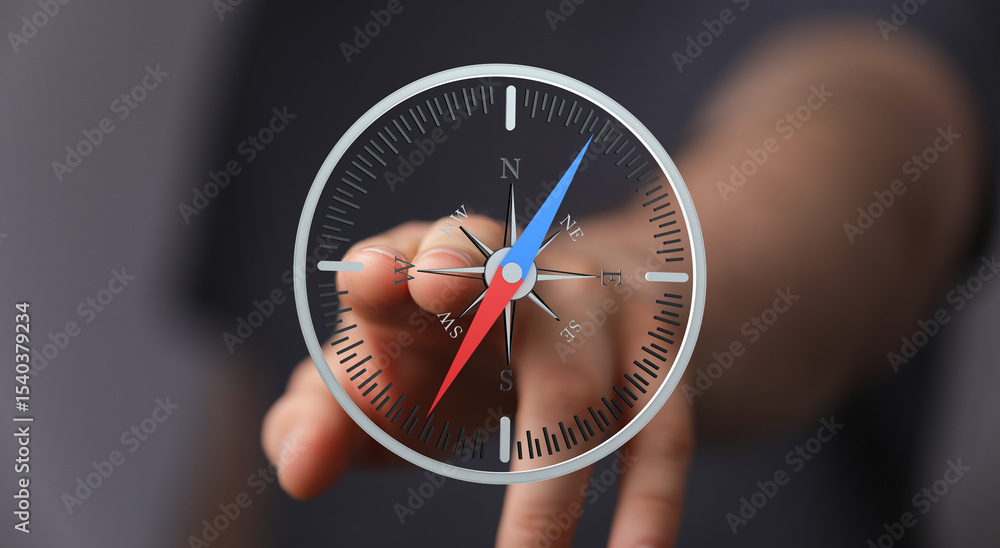 Poster Close-up of a hand interacting with a digital compass, symbolizing guidance and direction.