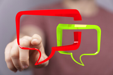 Hand pointing at digital speech bubbles,communication, conversation, feedback, online chat concept.