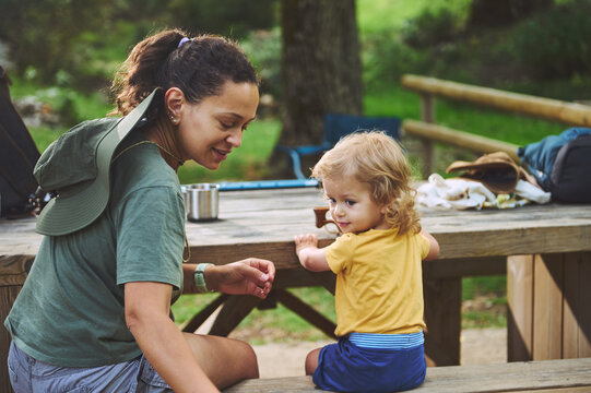 A Mother and Child Enjoying Quality Time Outside in a Peaceful Natural Setting