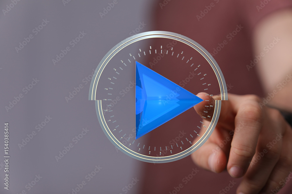 Aufkleber hand interacting with a futuristic play button interface. digital technology concept.