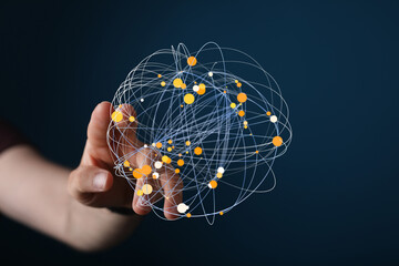 Hand interacting with a digital sphere representing global connections and networking.