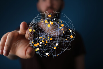 A hand interacts with a digital sphere, visualizing global network connections and data flow.