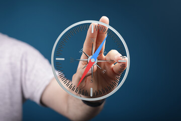 Person interacts with a virtual compass, symbolizing guidance and direction. Find your path.