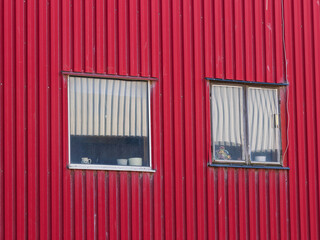 Worn out windows of an industrial building in Falkenberg highlighting urban decay and character