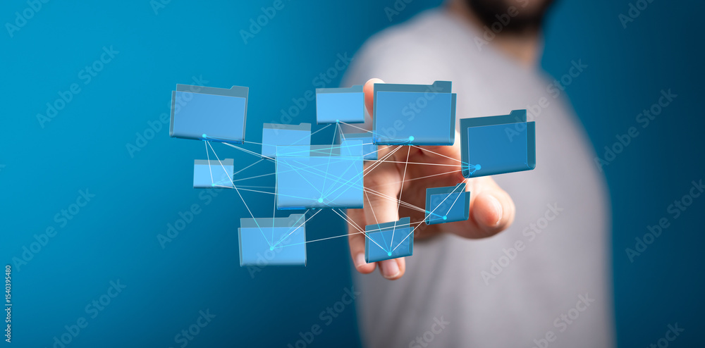Poster Hand interacting with a network of digital files.  Cloud storage, data management.