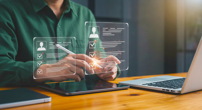 Person using digital pen on tablet with holographic checklist interface next to laptop on desk