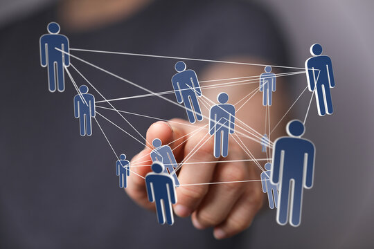 Image of a hand interacting with a network of interconnected people, symbolizing global communication and collaboration.