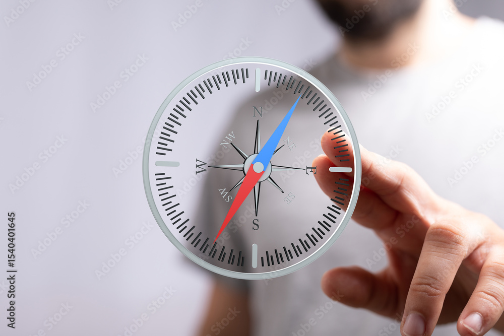 Aufkleber Finding your way:  Man interacts with a digital compass, showing direction and guidance.