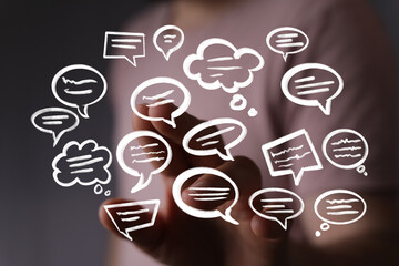 Person interacting with virtual speech bubbles, representing communication, conversation, and...