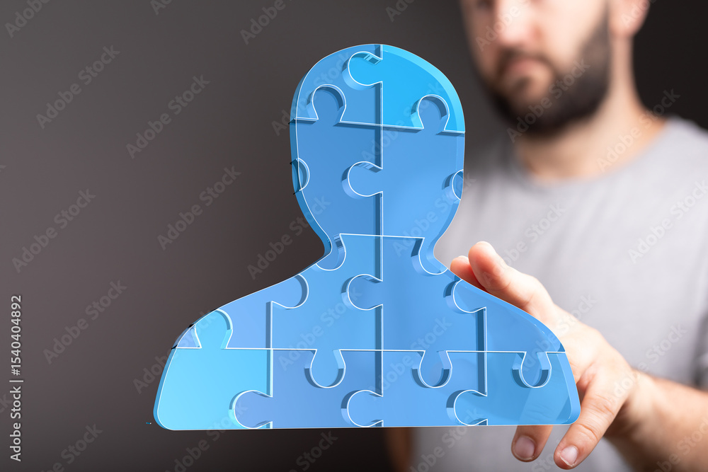 Poster abstract image of a person made of puzzle pieces, representing teamwork and collaboration.