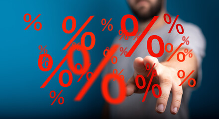 Image depicting a man interacting with large red percentage symbols, ideal for discount, sale, and...