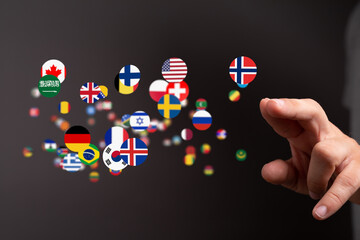 Image of diverse flags floating, symbolizing international communication and global reach.