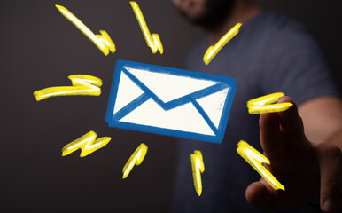 Hand reaching for glowing email icon.  Digital communication concept.