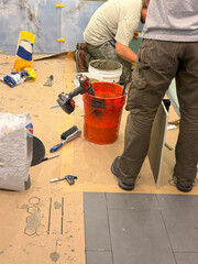 Workers Applying Finishing Touches to a Bathroom Construction Project Indoors