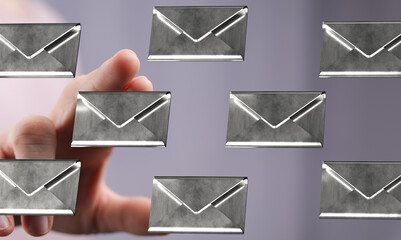 Image of a hand interacting with digital email icons, representing online communication and inbox...