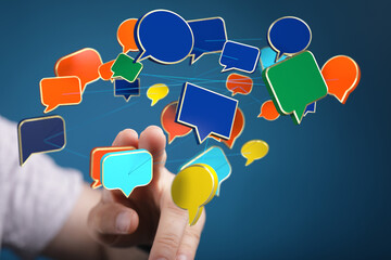 Hand interacting with digital speech bubbles, illustrating communication and networking.