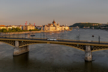 Scenic view of the famous Margit bridge acrossing over Danube river. Hungarian Parliament amazing building visible too in the photo