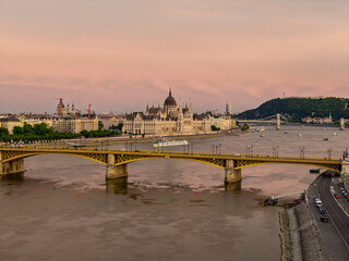 Scenic view of the famous Margit bridge acrossing over Danube river. Hungarian Parliament amazing building visible too in the photo