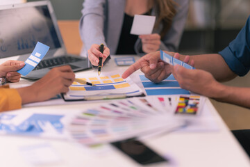 A design team focused on analyzing interface layouts and brainstorming to improve the user...