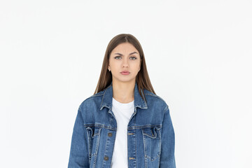 Hmm. Let me think. Studio shot of cute girl looking at camera with thoughtful and sly expression, raising one brow as if having good idea, planning something