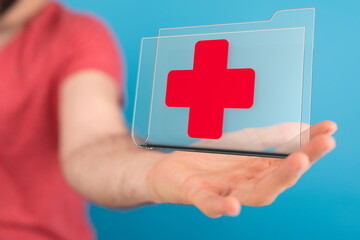 Person holding digital medical file with red cross. Secure online healthcare.