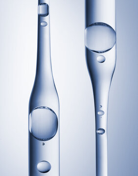 Clear cosmetic gel serum oil bubble in pipette. Hyaluronic skin care moisturizer texture product sample with bubbles macro