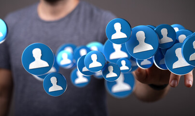 Person interacting with digital profile icons.  Networking, social media, online community concept.