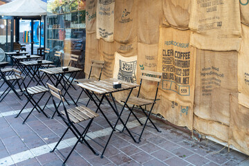 Petah Tikva, Israel, 12  JUNE 2025,  An Outdoor Cafe Area Decorated With Coffee Bean Sacks On The Wall.