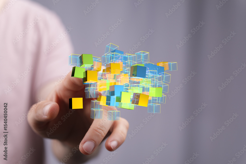 Poster Abstract image of a hand interacting with a cluster of colorful 3D cubes, representing data or technology.
