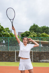 Tennis player. Glad beautiful woman showing happy emotion 