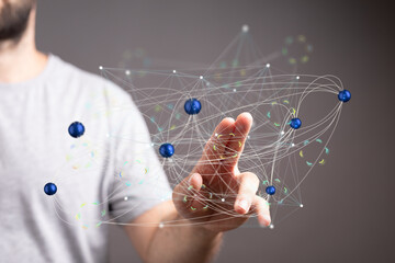 Man interacts with a digital network, representing global connections and data flow.