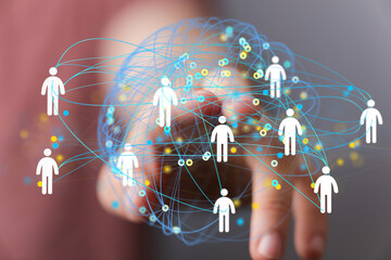Image depicts a hand interacting with a digital network of interconnected people, symbolizing...