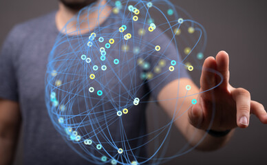 Person interacts with a digital network, illustrating global connectivity and data visualization.
