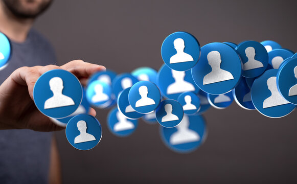 Image of a hand interacting with digital profile icons, representing social networking, online communities, and global connections.