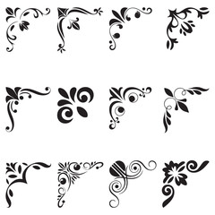 Set of twelve elegant black ornamental floral corner elements with swirl and leaf designs