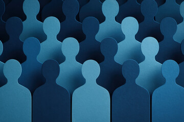 This symbolizes and connection through overlapping human silhouettes in varied blue shades reflecting teamwork and collaboration in business environments