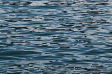 Golden blue sparkling water under the sunset