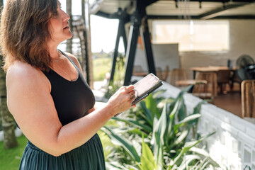 Female entrepreneur discusses strategy indoors during business meeting, illustrating collaboration,...