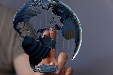 High-quality stock photo of a hand interacting with a digital globe, representing global...