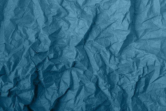 Abstract wrinkled blue crumpled paper texture background