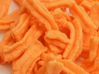 Savory rice crackers piled on white plate