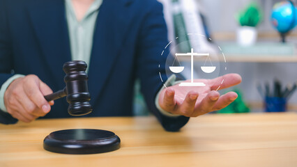 Person holding a gavel with a glowing scales of justice icon, Legal authority, fair judgment, law services. Perfect for justice, legal proceedings, courtroom concepts, ethical decision-making.