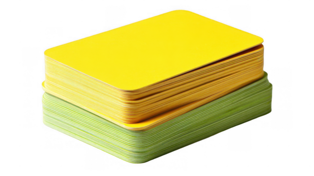 Two stacks of blank cards, one yellow and one green, are neatly arranged on a transparent background, creating a vibrant and organized visual - Powered by Adobe